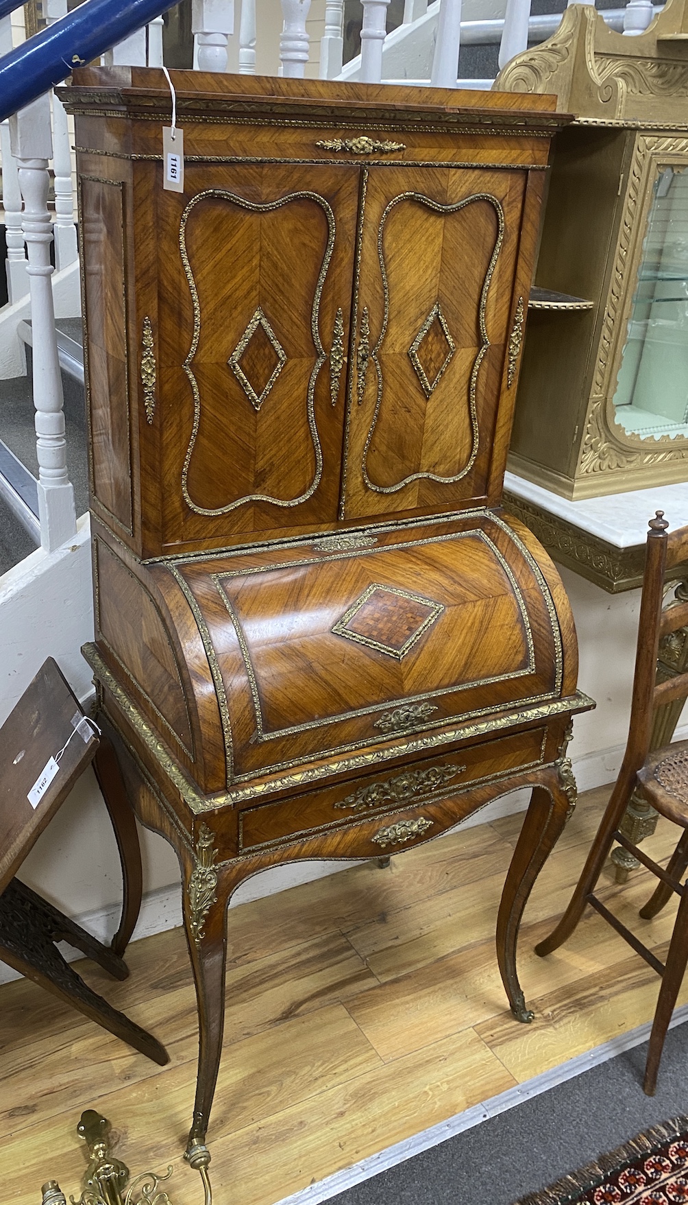 A French gilt metal mounted kingwood cylinder bureau cabinet, width 69cm, depth 50cm, height 157cm
